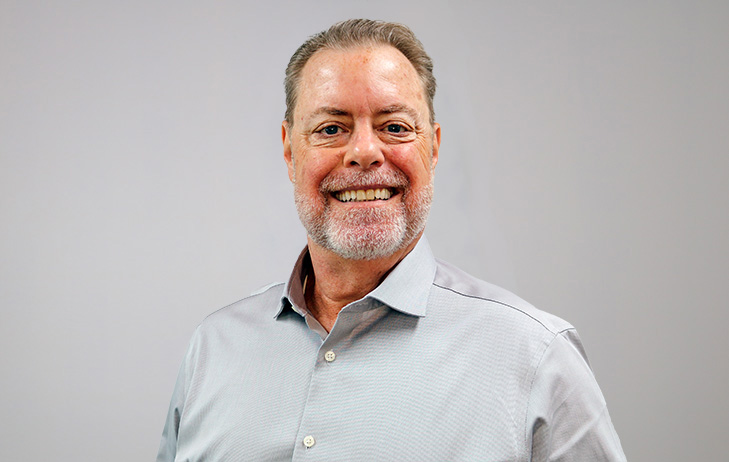 Professional headshot of Corky Miller